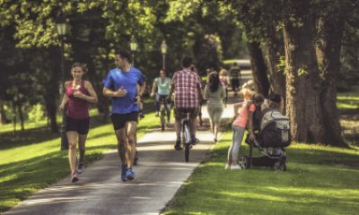 Two people running in park.
