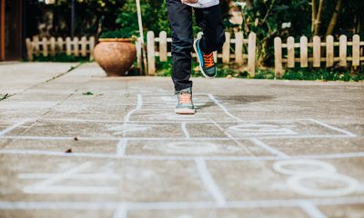 Kid playing hop scotch