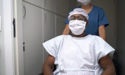 Patient in wheelchair before surgery.