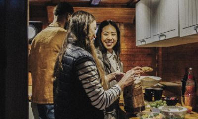 Young people prepare food in a cozy kitchen