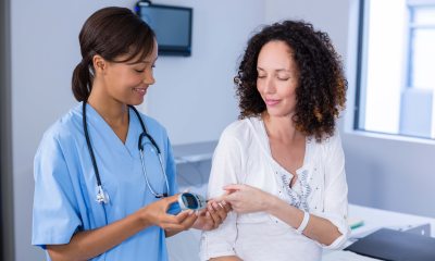A healthcare provider checks a patient's blood oxygen levels