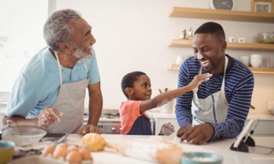 Three generations of men baking in the kitchen