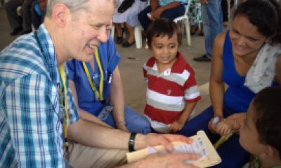 A PeaceHealth provider and family talking and smiling at each other.