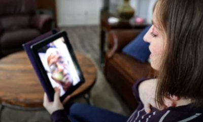 Woman talks with a doctor using her tablet